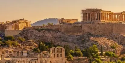 green trees and ruins of ancient buildings