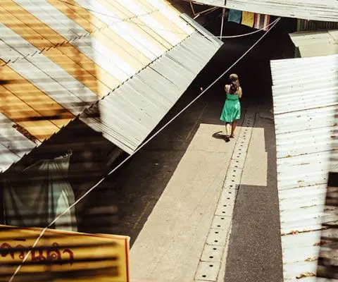 Woman walking in markets in Chiang Mai, Thailand