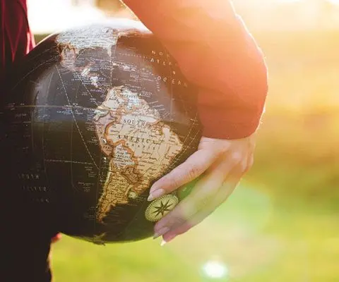 Girl holding a globe