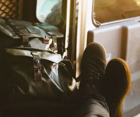 boots and a backpack in a car