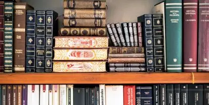 books stacked on a book shelf