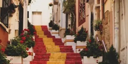 red and yellow stairs in narrow street