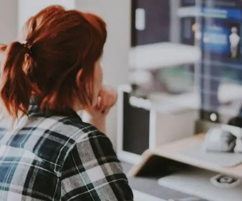 person using imac at home