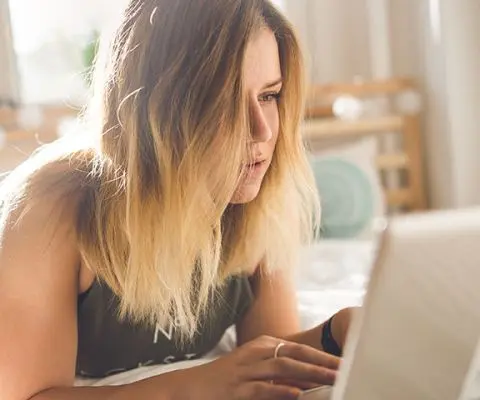 A woman working on her laptop