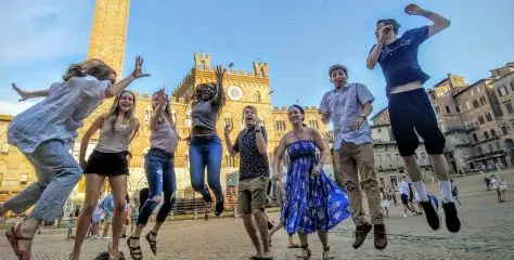 Students taking a picture together before exploring the road.