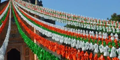 white, red, and green bunting strung from top of church