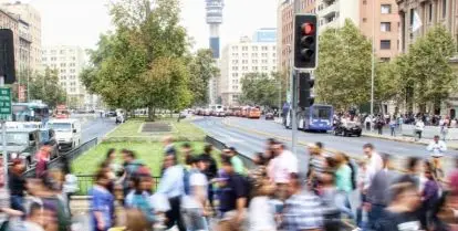 blurred timelapse of crowd of people crossing city street